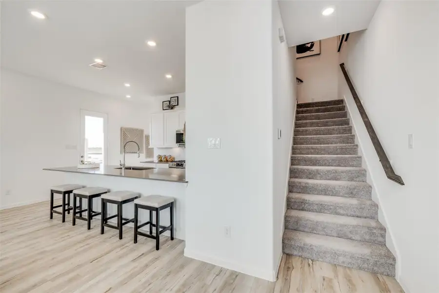 Furnished interior view inside a new home in Bridgeland, Cypress (Image 7).