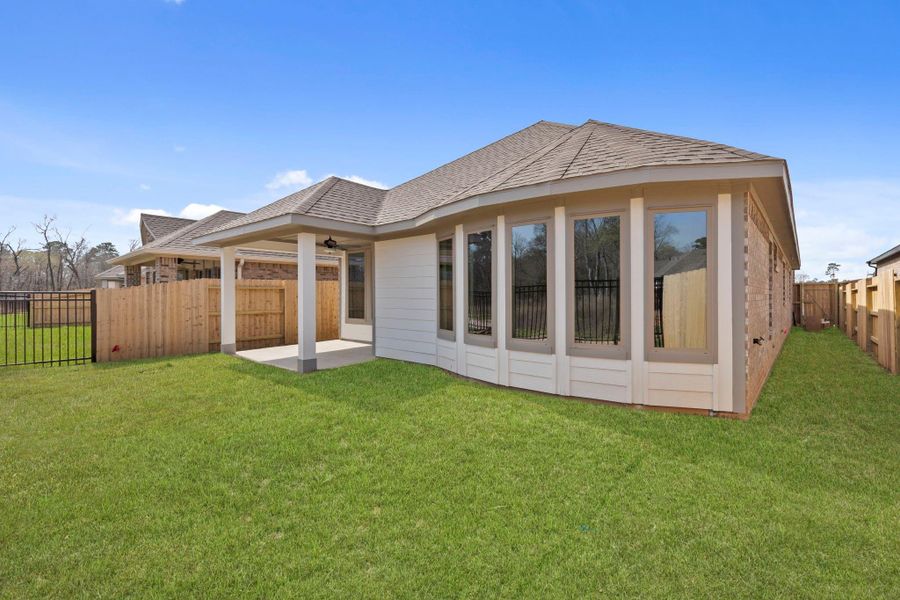 Exterior details and patio area of a home in Grand Central Park, Conroe (Image 22).