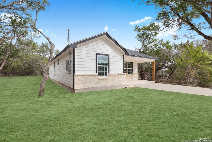 Exterior details and patio area of a home in , Spring Branch (Image 3).