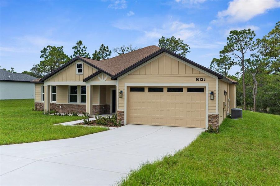 Front exterior of a new home in , Weeki Wachee, FL, highlighting curb appeal (Image 22).