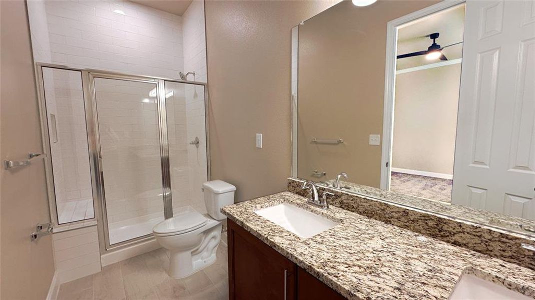 Tile to ceiling plus shower seat, granite double vanity