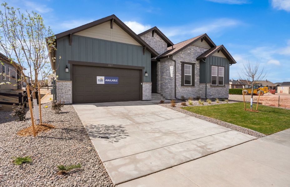 Front exterior of a new home in Hilltop at Inspiration, Aurora, CO, highlighting curb appeal (Image 2).