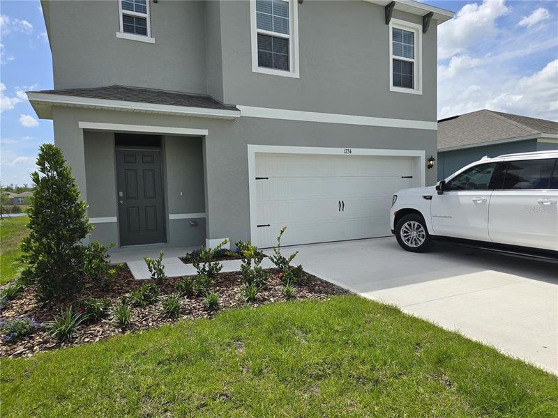 Exterior details and patio area of a home in Charles Cove Express, Davenport (Image 3).