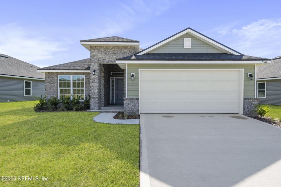 Front exterior of a new home in Summerglen, Jacksonville, FL, highlighting curb appeal (Image 22).