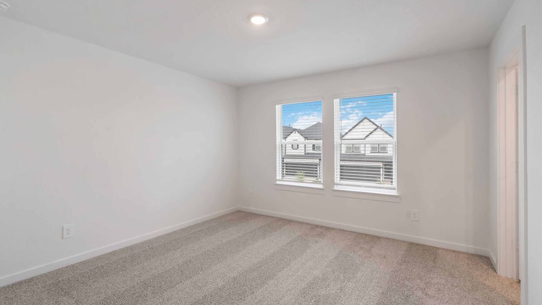 Representative unfurnished interior of a home built from the Iris by D.R. Horton in City Gate North, Houston (Image 11).