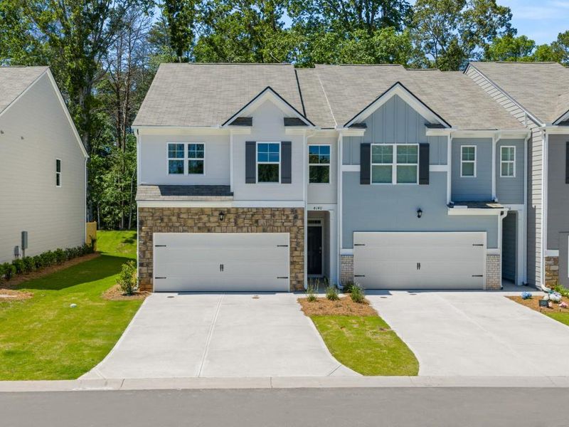 Front exterior of a new home in Falcon Landing Townhomes, Gainesville, GA, highlighting curb appeal (Image 2).