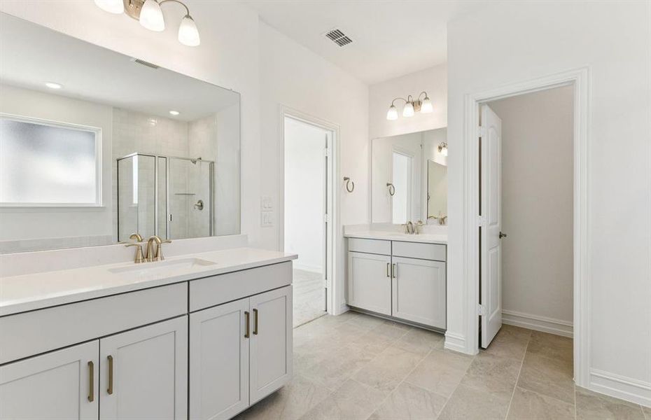 Luxurious owner's bath complete with double sinks Luxurious owner's bath complete with double sinks