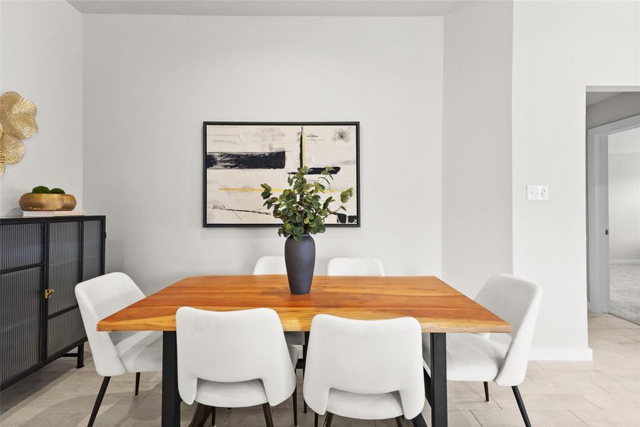 This dedicated dining area offers a stylish spot for shared meals, with easy flow into the surrounding rooms and plenty of space to fit the table of your choice. Neutral tile flooring and crisp white walls create a versatile backdrop that pairs well with any design style. It's a flexible space ready for everyday dinners or special occasions alike. This dedicated dining area offers a stylish spot for shared meals, with easy flow into the surrounding rooms and plenty of space to fit the table of your choice. Neutral tile flooring and crisp white walls create a versatile backdrop that pairs well with any design style. It's a flexible space ready for everyday dinners or special occasions alike.