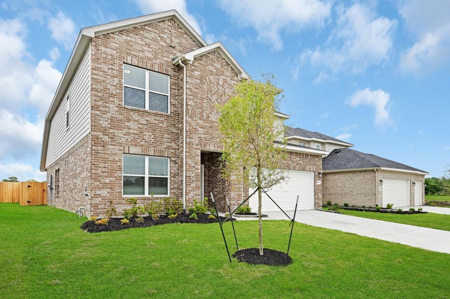 Front exterior of a new home in Lago Mar, Texas City, TX, highlighting curb appeal (Image 16). Front exterior of a new home in Lago Mar, Texas City, TX, highlighting curb appeal (Image 16).