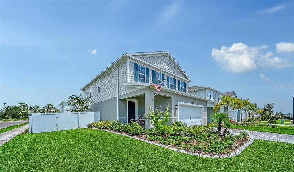 Front exterior of a new home in , Bradenton, FL, highlighting curb appeal (Image 25).