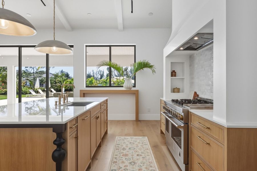 Rift cut white oak bottom cabinets with integrated trash and dishwasher