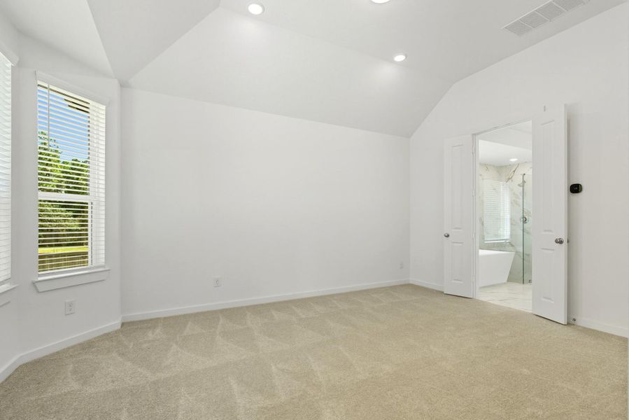 Spacious primary room is just past the kitchen. Spacious primary room is just past the kitchen.