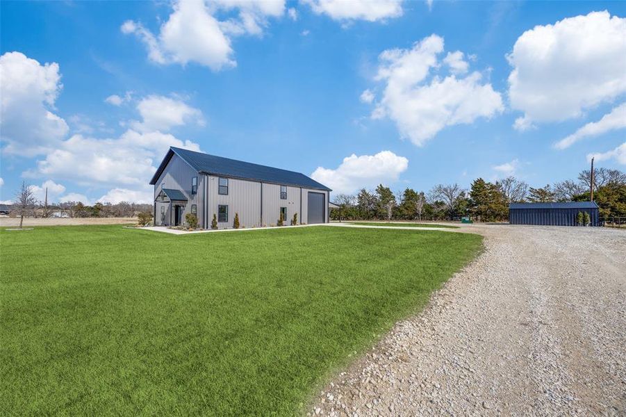 An extra outbuilding allows for storage or parking.