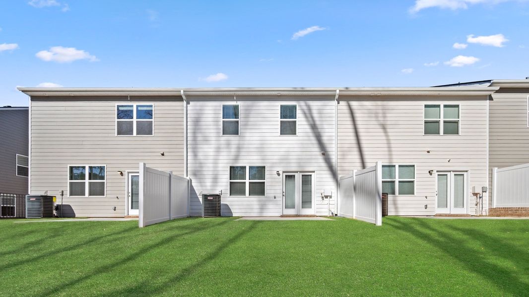 Exterior details and patio area of a home in Inverness at Sugarloaf, Lawrenceville (Image 3).