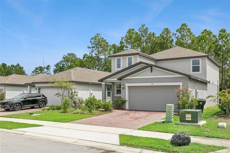 Front exterior of a new home in , Daytona Beach, FL, highlighting curb appeal (Image 25).