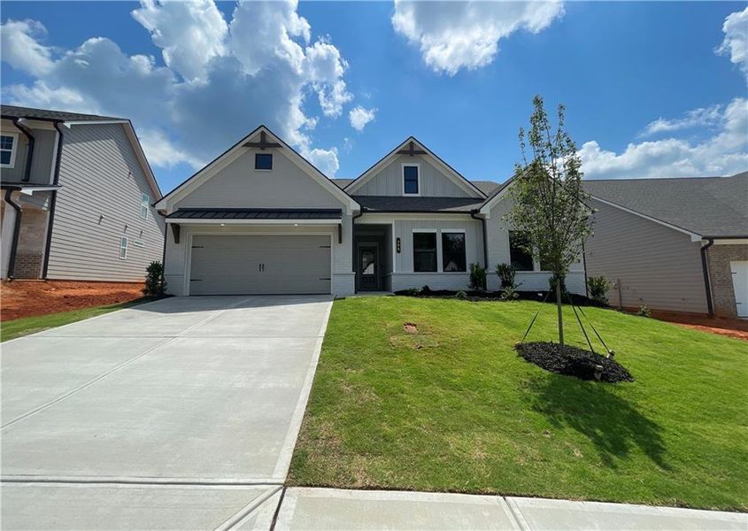 Front exterior of a new home in Summerlin, Winder, GA, highlighting curb appeal (Image 1). Front exterior of a new home in Summerlin, Winder, GA, highlighting curb appeal (Image 1).