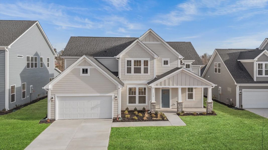 2 story single family home, all white with a 2 car garage