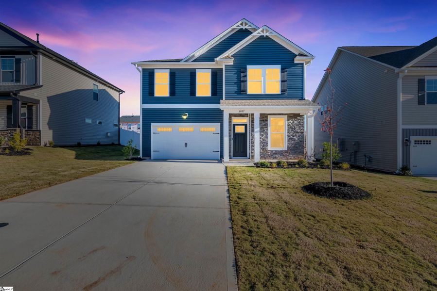 Front exterior of a new home in Halton Oaks, Spartanburg, SC, highlighting curb appeal (Image 17).
