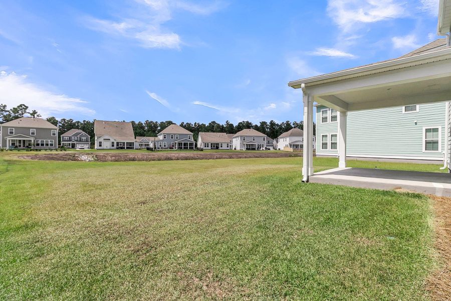 Front exterior of a new home in Tidewater at Lakes of Cane Bay, Summerville, SC, highlighting curb appeal (Image 20).