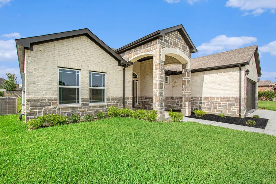 Front exterior of a new home in Columbia Lakes, West Columbia, TX, highlighting curb appeal (Image 1). Front exterior of a new home in Columbia Lakes, West Columbia, TX, highlighting curb appeal (Image 1).