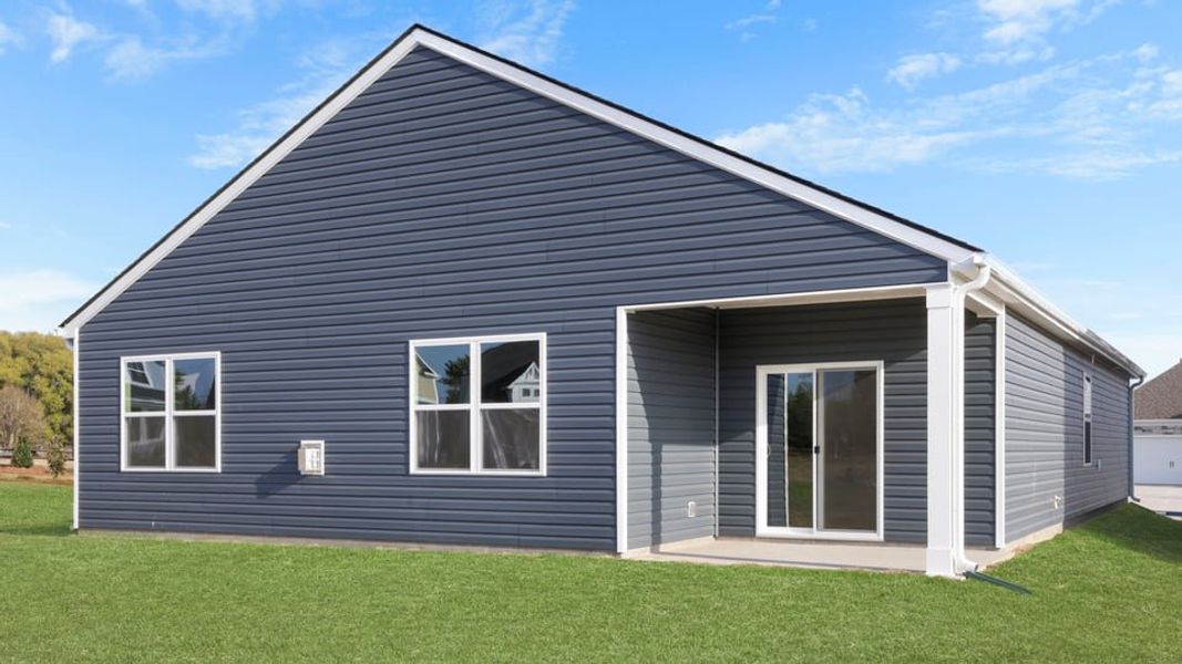 Exterior details and patio area of a home in Durbin Meadows Traditions, Fountain Inn (Image 3).