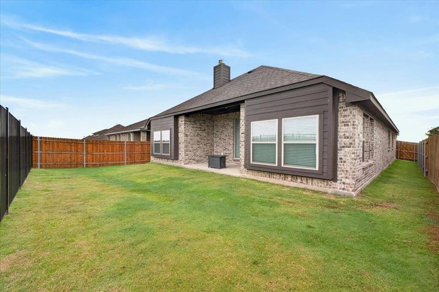 Exterior details and patio area of a home in , Godley (Image 25).