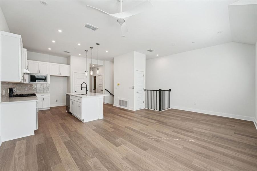 The open space provides a great foundation for you to configure and personalize just the way you like it. (Sample photo of finishes and layout)