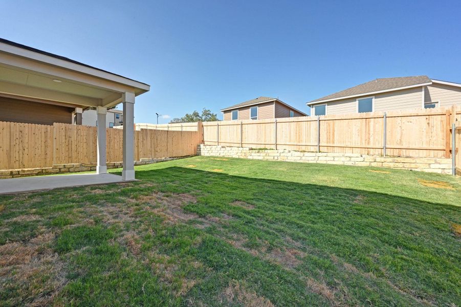 Exterior details and patio area of a home in Creekside at Estancia, Austin (Image 3).