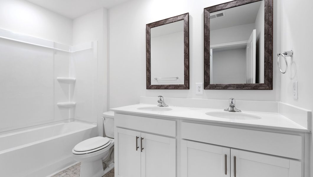 Representative furnished interior of a home built from the BELHAVEN by D.R. Horton in Benjamin's Grove, Woodruff (Image 13).