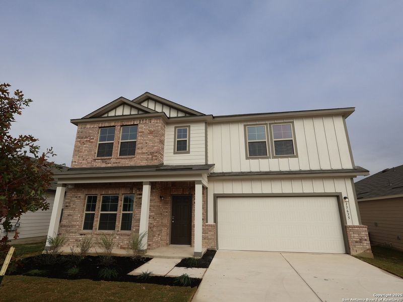 Front exterior of a new home in Winding Brook, San Antonio, TX, highlighting curb appeal (Image 21).