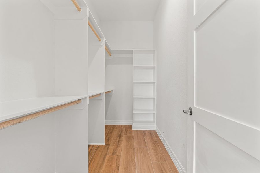 Generous walk-in closet within the office/guest suite offering excellent storage and organization options.