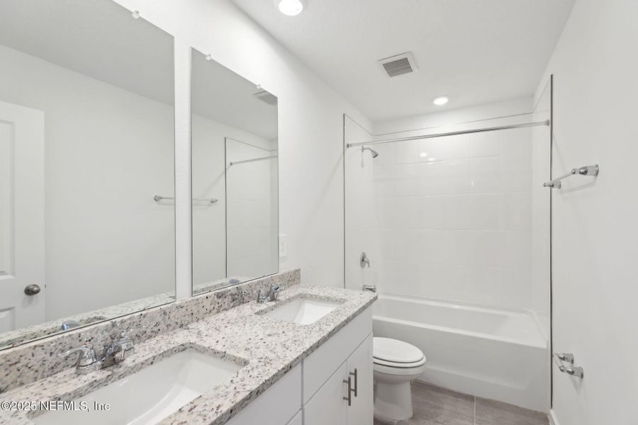 Furnished interior view inside a new home in Lakes at Bella Lago - Signature Series, Green Cove Springs (Image 5). Furnished interior view inside a new home in Lakes at Bella Lago - Signature Series, Green Cove Springs (Image 5).