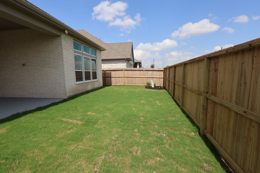 Exterior details and patio area of a home in Harvest Green - Reserve Collection, Richmond (Image 3).