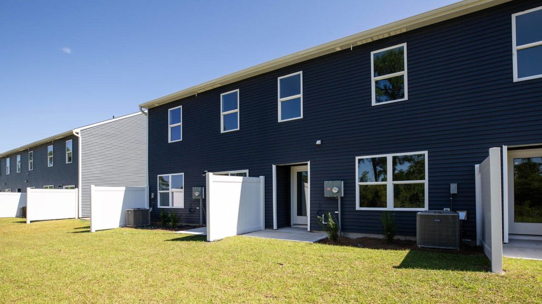 Exterior details and patio area of a home in Waterside Townhomes, Surf City (Image 3).