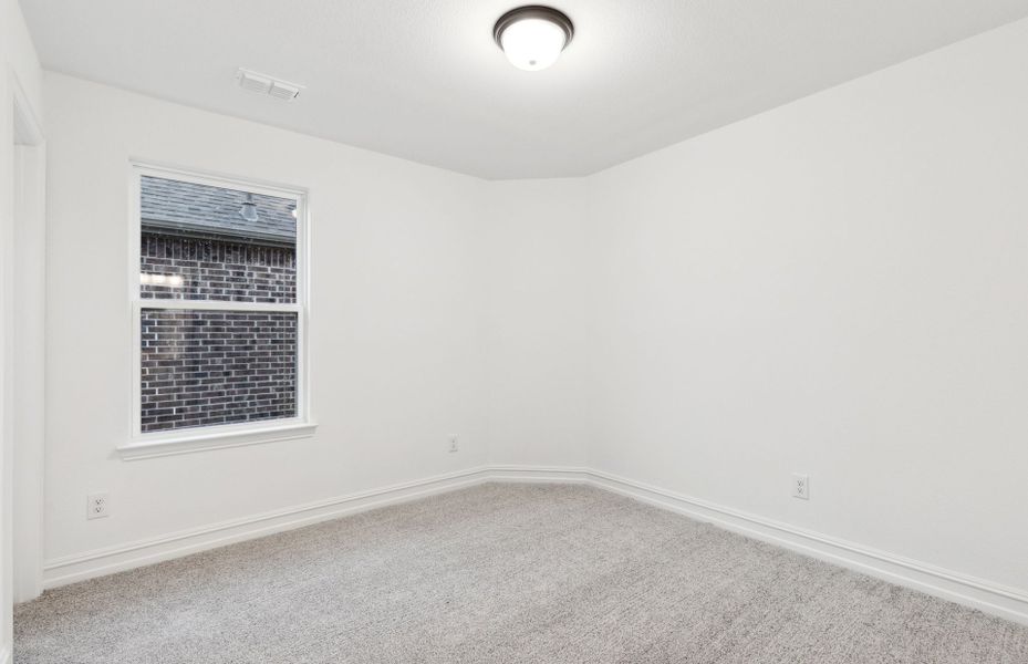 Spacious secondary bedroom with ample closet space