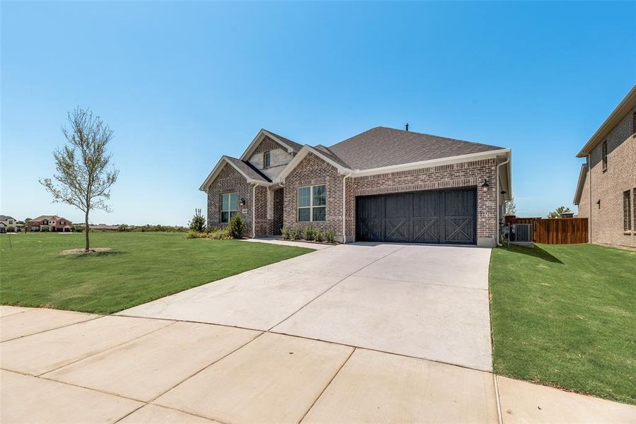 Front exterior of a new home in Villages of Creekwood, Frisco, TX, highlighting curb appeal (Image 21). Front exterior of a new home in Villages of Creekwood, Frisco, TX, highlighting curb appeal (Image 21).