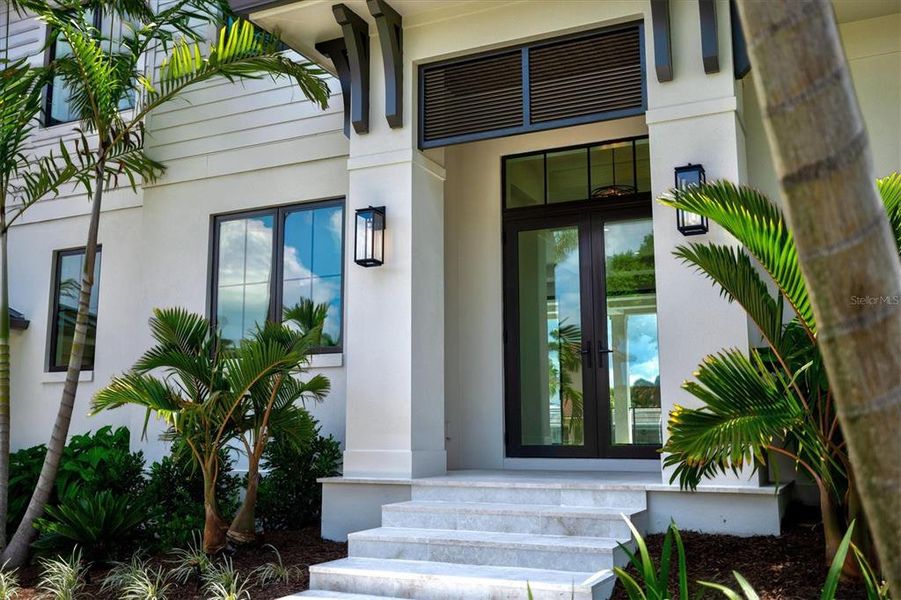 Front exterior of a new home in , Longboat Key, FL, highlighting curb appeal (Image 26). Front exterior of a new home in , Longboat Key, FL, highlighting curb appeal (Image 26).