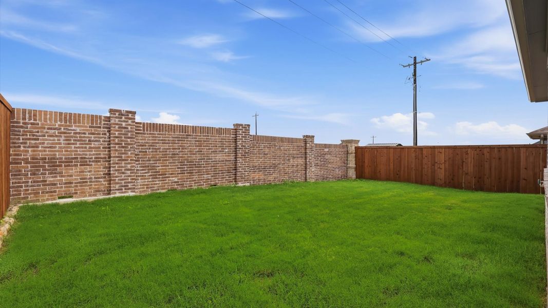 Exterior details and patio area of a home in Westridge Journey, Princeton (Image 29).