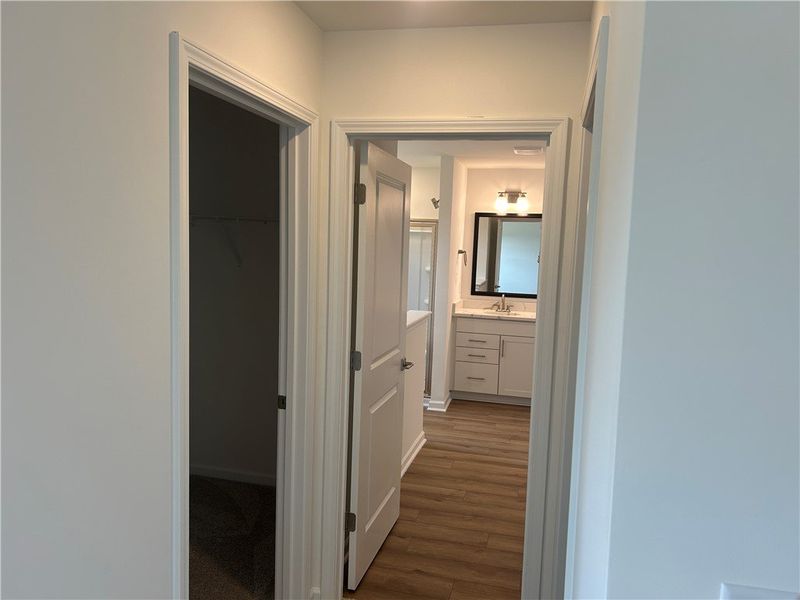 Clean lines and wood-look flooring lead to a well-