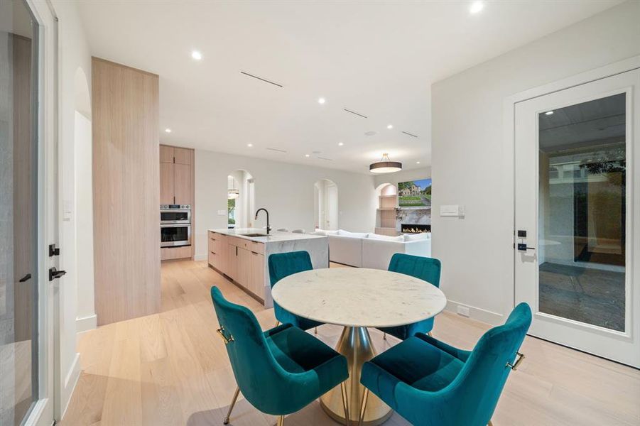 The breakfast area blends to the kitchen seamlessly, and give access to not only the pool and backyard but a second side patio.