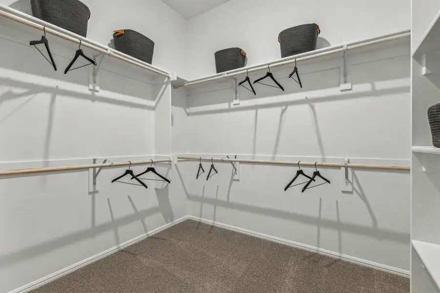 Primary Closet in the Turquoise home plan by Trophy Signature Homes – REPRESENTATIVE PHOTO Primary Closet in the Turquoise home plan by Trophy Signature Homes – REPRESENTATIVE PHOTO