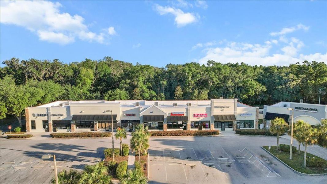 Front exterior of a new home in Twisted Oaks, Beverly Hills, FL, highlighting curb appeal (Image 1).
