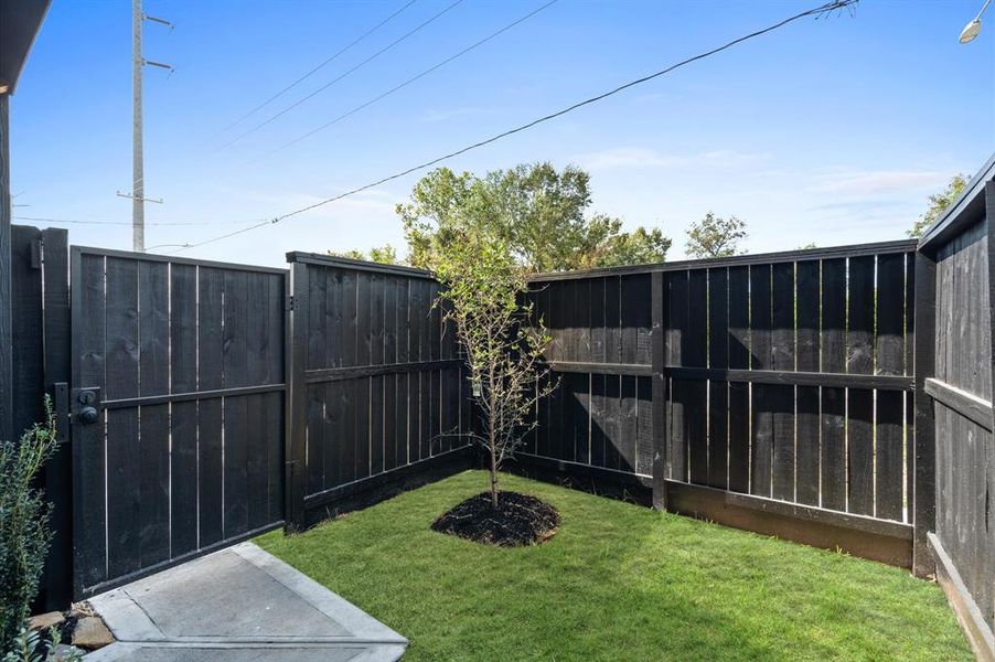 Low maintenance privately fenced  backyard.