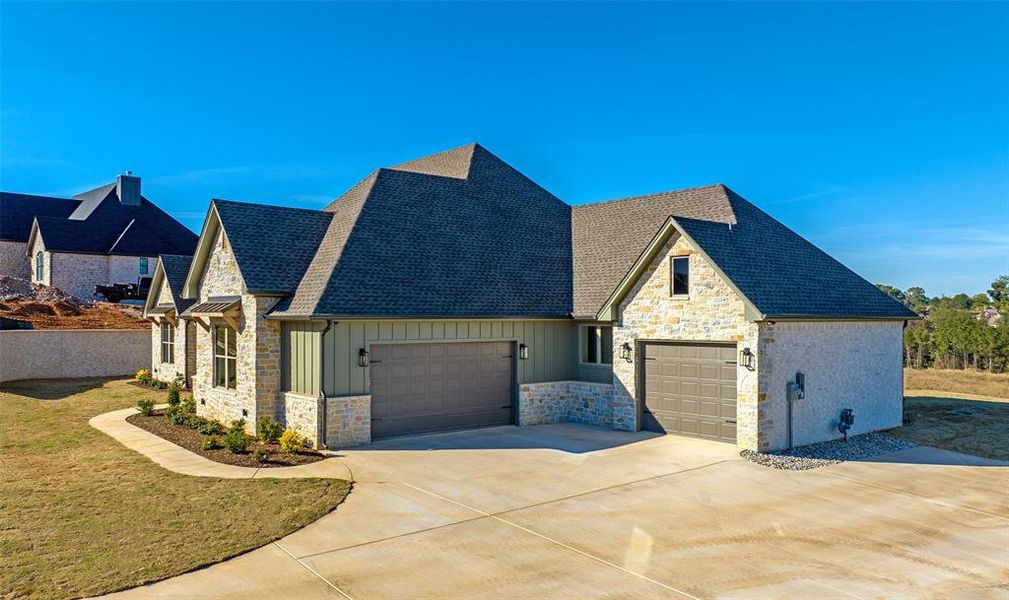 Front exterior of a new home in , Longview, TX, highlighting curb appeal (Image 1).