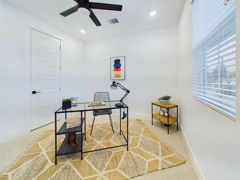 Secondary Bedroom located on the first floor. Vinyl windows with retractable panels allow in tons of natural light.