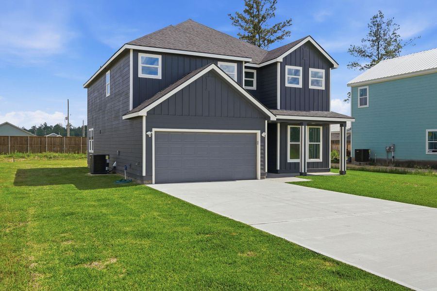 Front exterior of a new home in , Conroe, TX, highlighting curb appeal (Image 22).