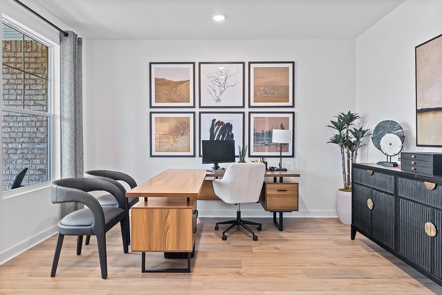 A room with a desk and chairs. A room with a desk and chairs.