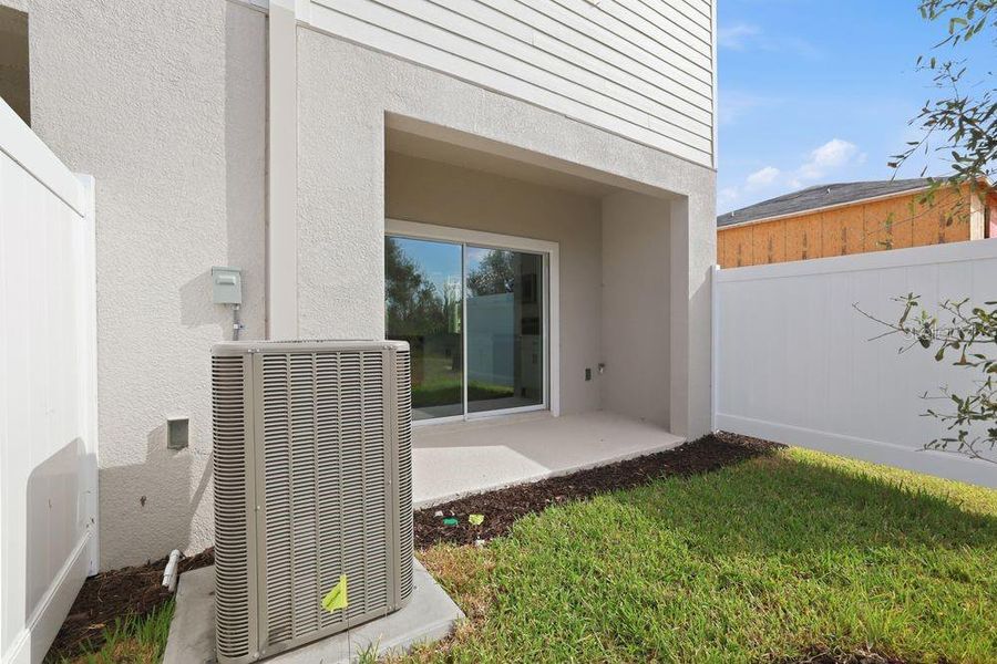 Exterior details and patio area of a home in The Towns at Firethorn, Parrish (Image 3).