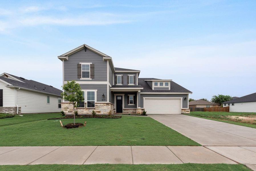Front exterior of a new home in Creekside of Crowley, Crowley, TX, highlighting curb appeal (Image 23). Front exterior of a new home in Creekside of Crowley, Crowley, TX, highlighting curb appeal (Image 23).