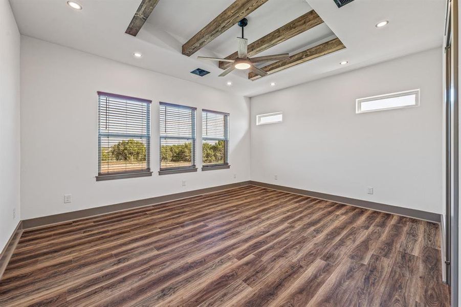 Unfurnished room featuring beamed ceiling, dark wood finished floors, recessed lighting, and ceiling fan